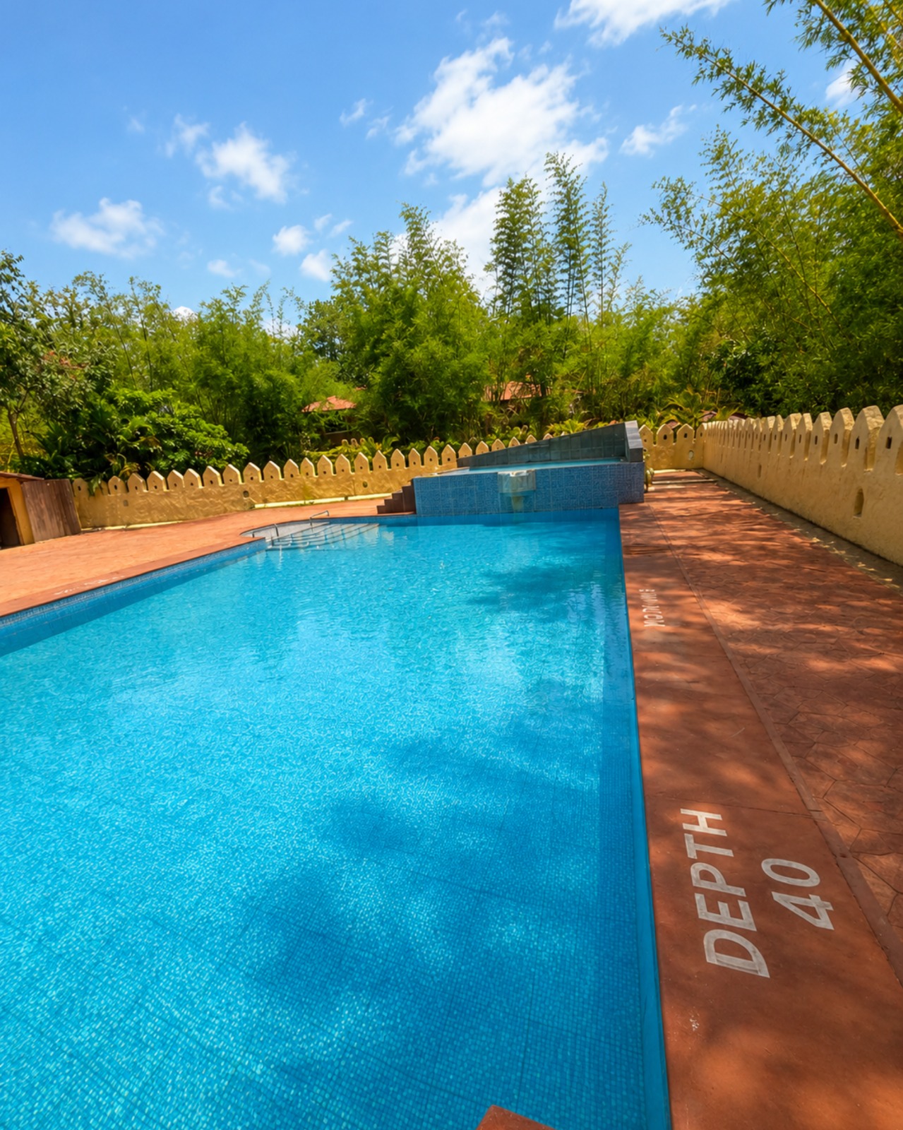 Swimming pool at Mahua Tiger Resort Kanha in daylight