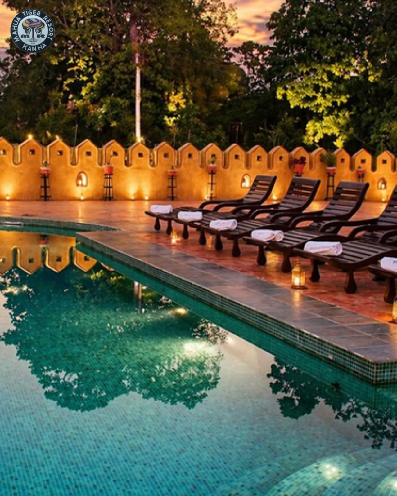 Mahua Tiger Resort Kanha swimming pool in the evening